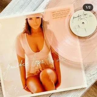 a record on a white surface
